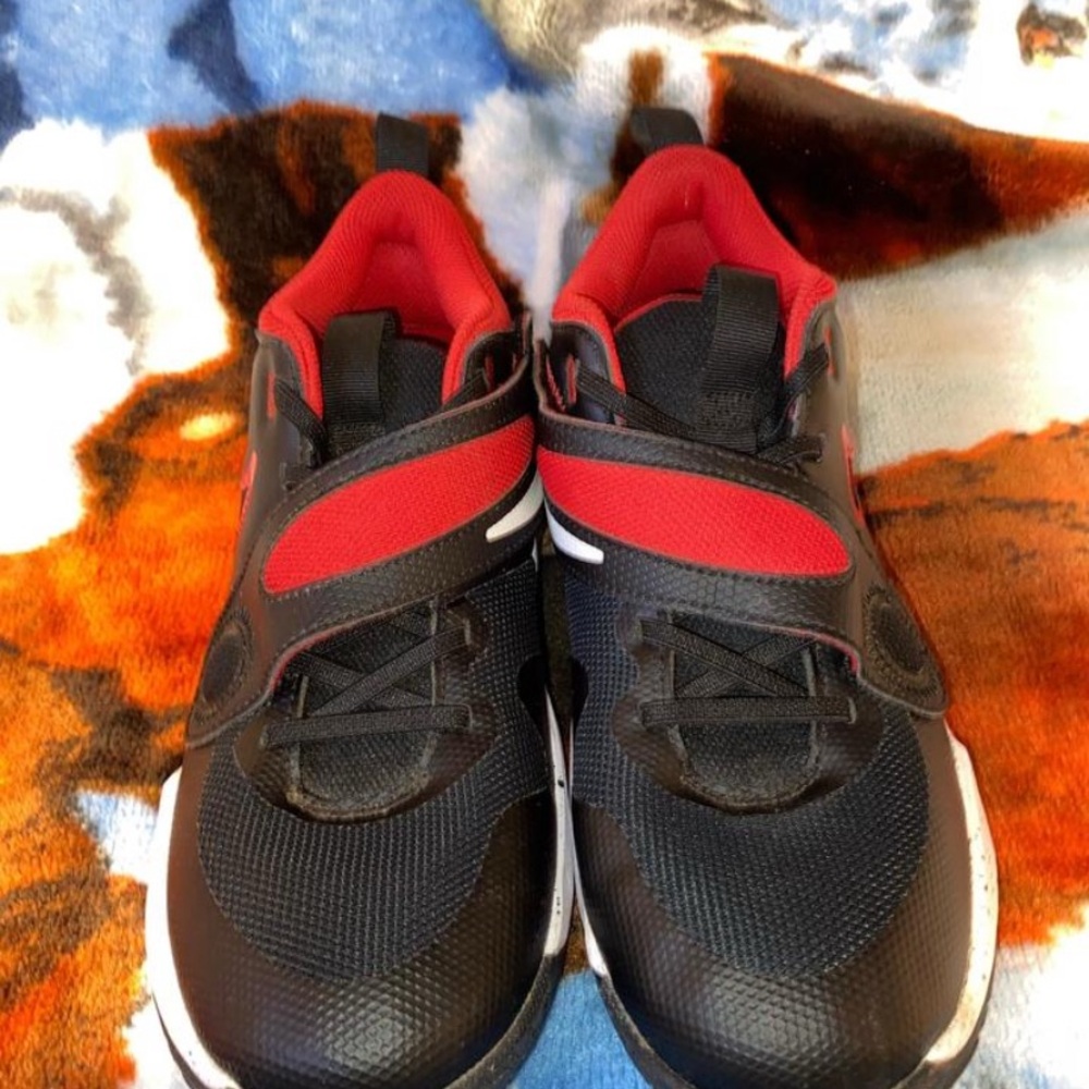 NIKE Team Hustle Black and Red Athletic Shoes